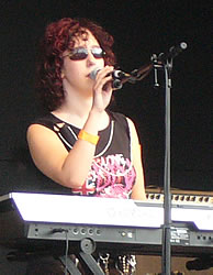 Susan Hedges sings at her keyboard